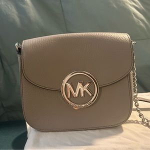 The cutest little purse ever.   The neutral color is the perfect fall purse.